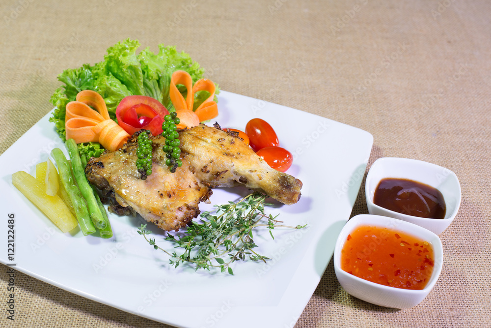 Grilled Chicken steak with sweet sauce sauce, In white dish on t Grilled Chicken steak with sweet sauce sauce, In white dish on t