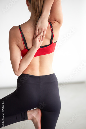 young woman doing shoulder stretch