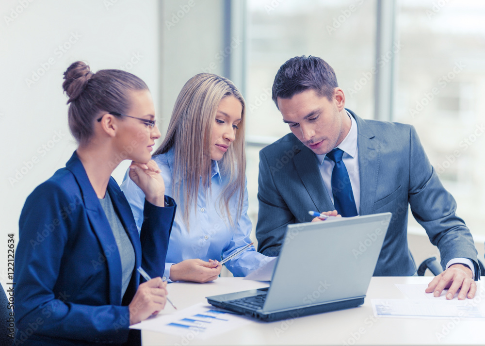 business team with laptop having discussion business team with laptop having discussion