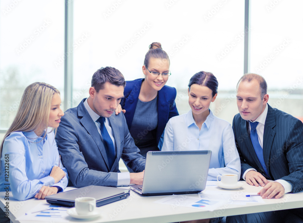 business team with laptop having discussion business team with laptop having discussion