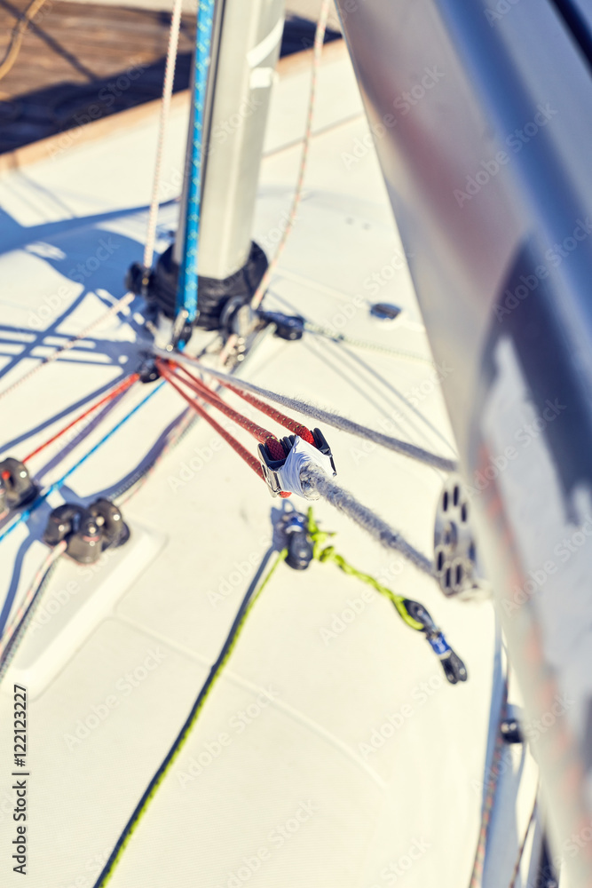 A boom vang or kicking strap is a line or piston system on a sailboat used to exert downward force on the boom and thus control the shape of the sail.