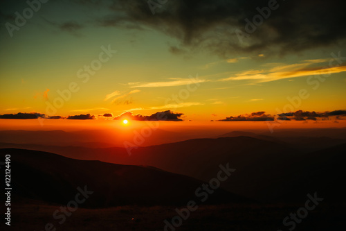 sunset or sunrise in mountains