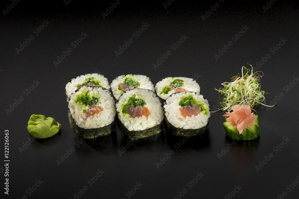 fresh sushi rolls hosomaki decorated with seaweed salad and wasa fresh sushi rolls hosomaki decorated with seaweed salad and wasa