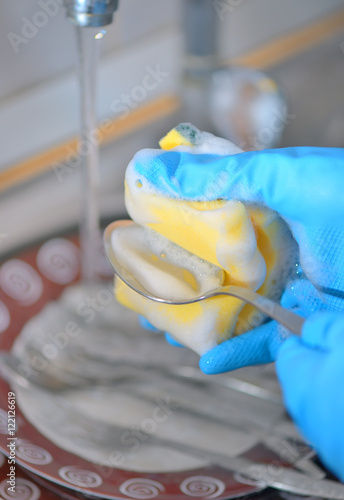 Woman hand washing dishes