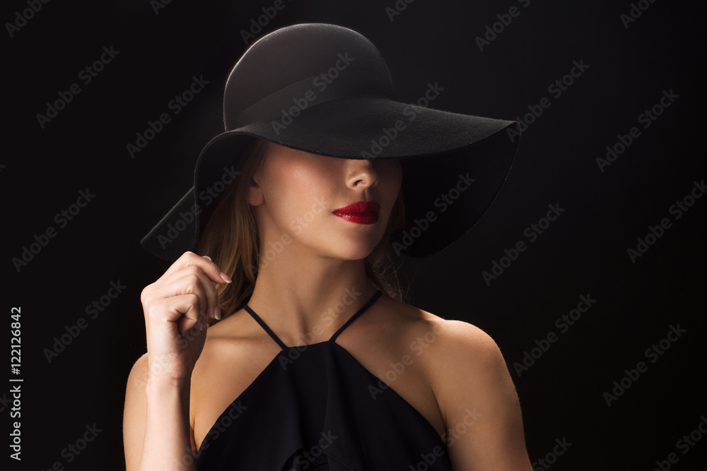 beautiful woman in black hat over dark background beautiful woman in black hat over dark background