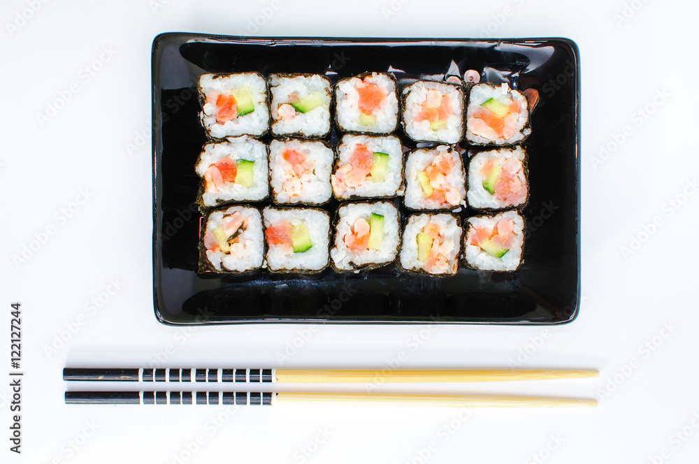 Sushi set on black clasic asian plate Sushi set on black clasic asian plate