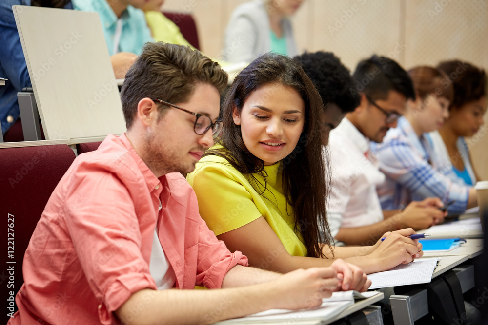 group of international students writing at lecture group of international students writing at lecture