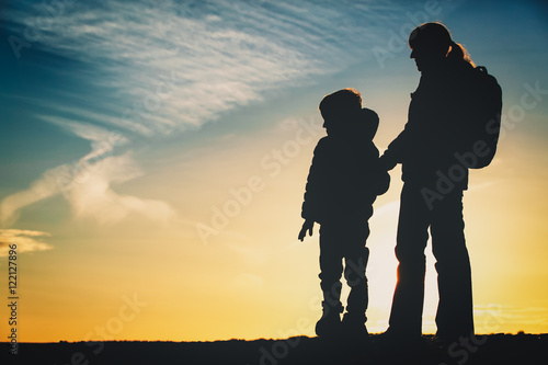 mother and son travel at sunset