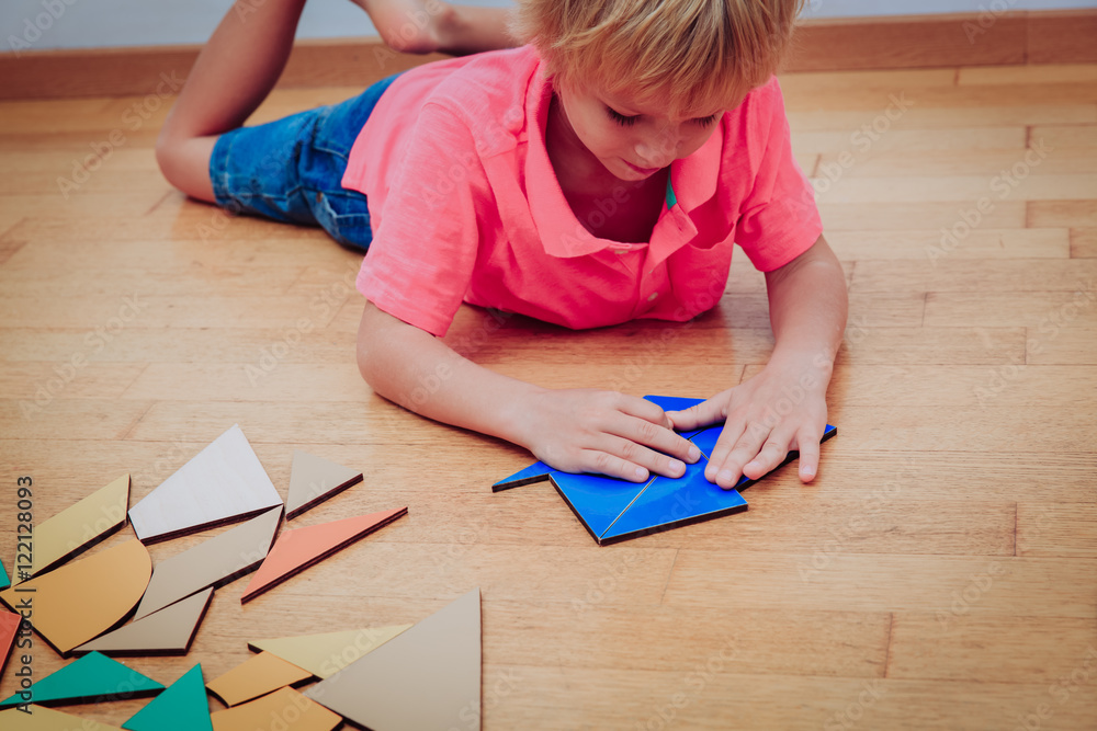 little boy playing with puzzle, education and learning concept little boy playing with puzzle, education and learning concept