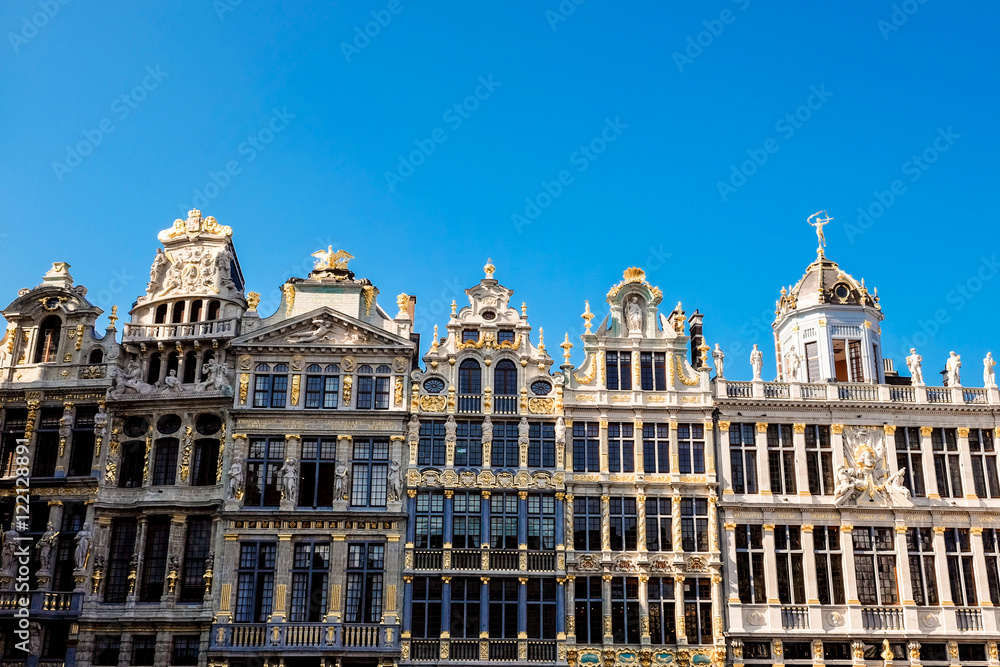 The Grand Place is the central square of Brussels. It is surrounded by opulent guildhalls and two larger edifices, the city's Town Hall, and the Breadhouse