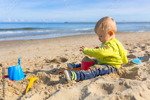Little boy on the beach of Baltic Sea in Poland