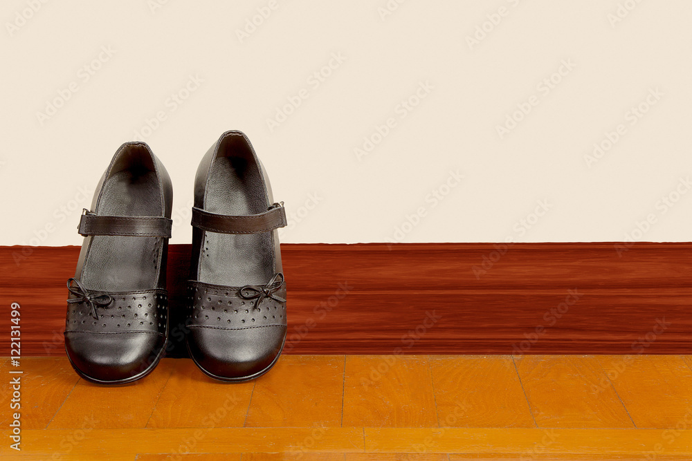 School Girl Black Pair of Shoes on Wooden Floor School Girl Black Pair of Shoes on Wooden Floor