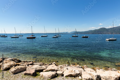 Принти на полотні Shore of the Lake Garda in the village of Torri del Benaco in Italy