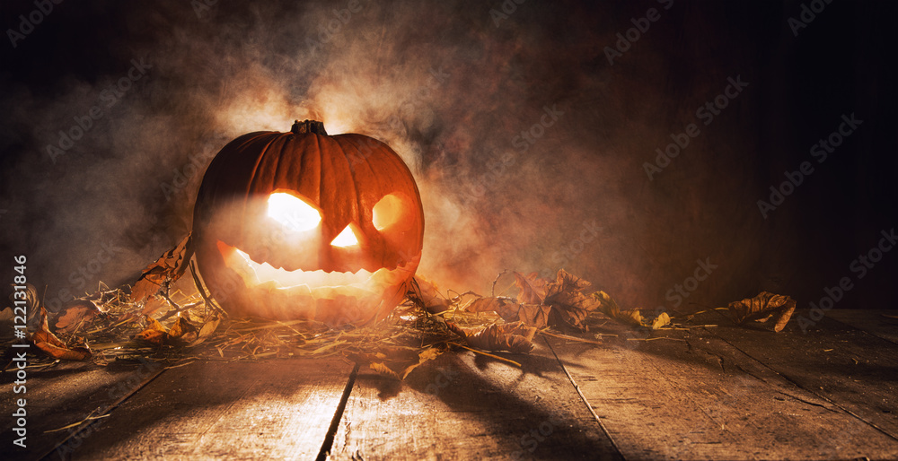 Fototapeta premium Scary halloween pumpkin on wooden planks