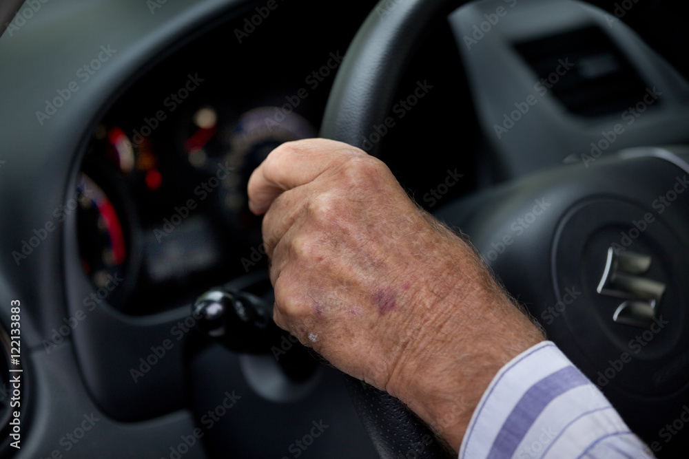 Old man driving car
