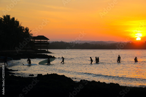 Photography Surfers Walking Back to the Beach With their Surfboards, Orange Sunset Silhouett