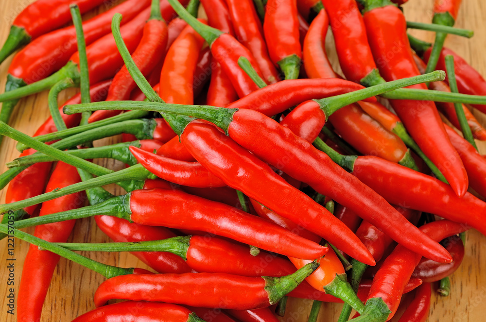 red hot chilly pepers with fresh green stem