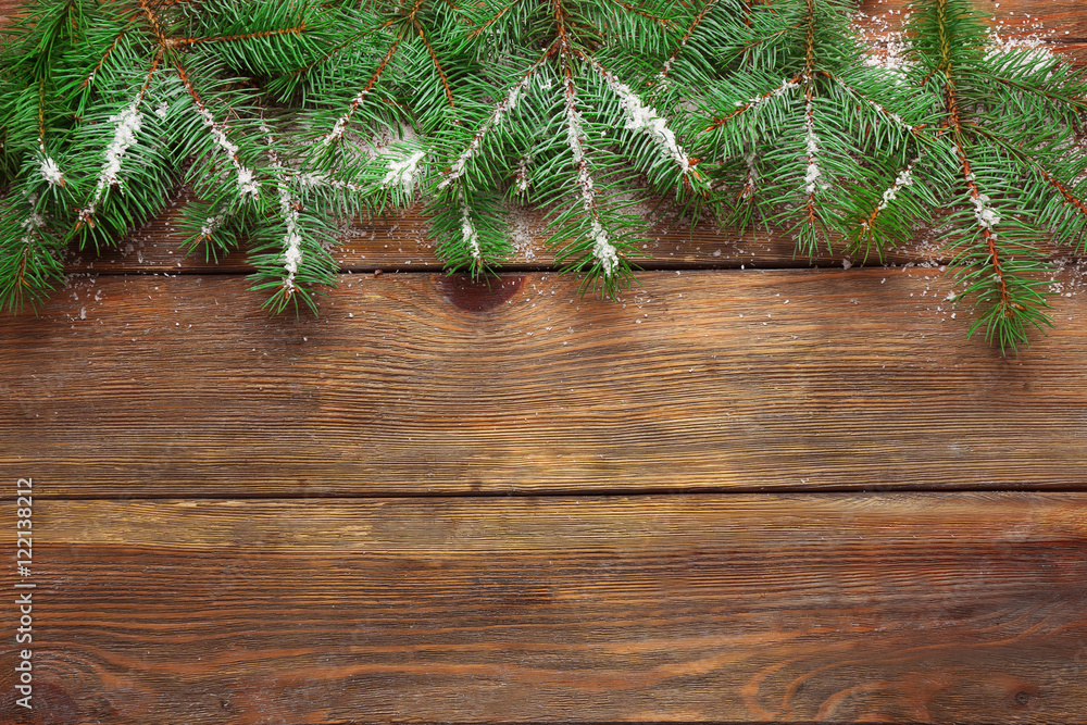 Christmas fir tree on wooden background Christmas fir tree on wooden background