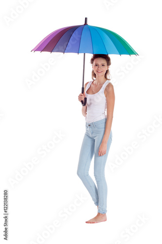 Pretty girl posing with color umbrella on white background