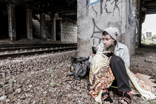 Homeless woman having meal