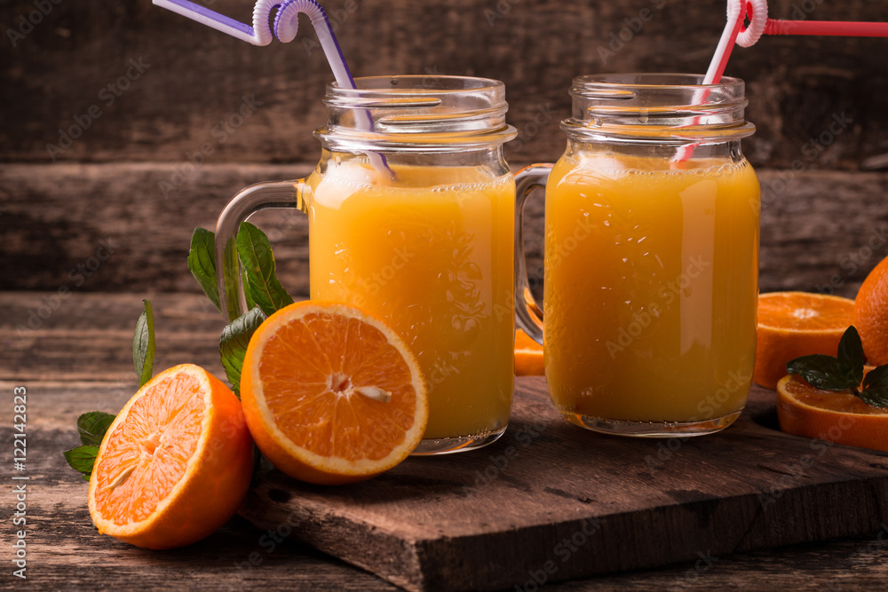 Citrus juice and fruits on wooden background. Citrus juice and fruits on wooden background.