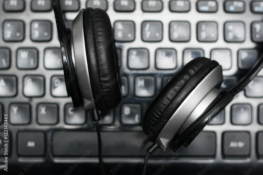 Headphones on laptop keyboard Headphones on laptop keyboard