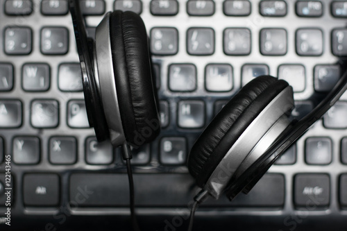 Headphones on laptop keyboard