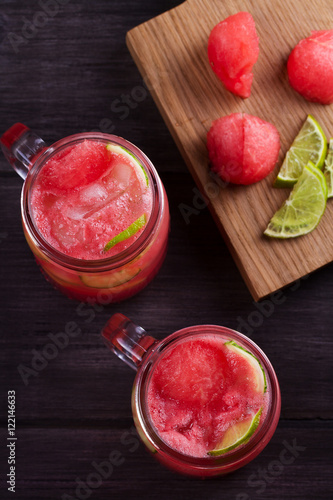 Watermelon cocktail with lime and cucumber. Healthy and detox drinks. View from above, top studio shot