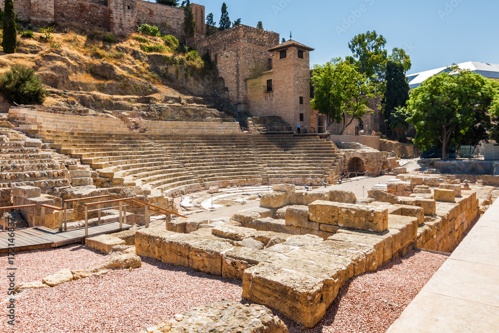 Sunny view of ancient amphitheater Teatro Romano de Malaga,  Malaga, Andalusia province, Spain.