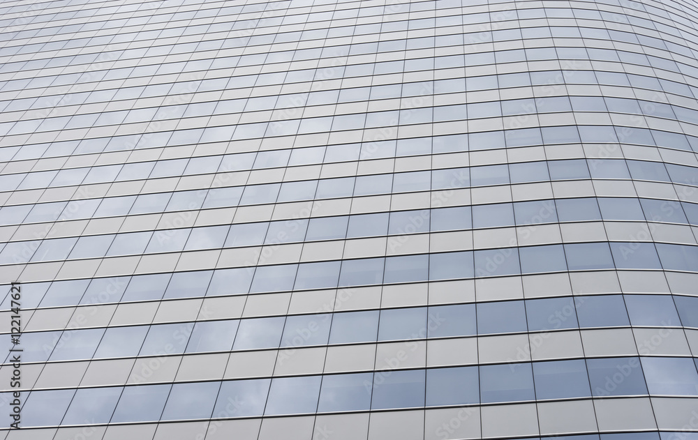 glass modern business office building with cloud and sky reflecting,selective focus glass modern business office building with cloud and sky reflecting,selective focus