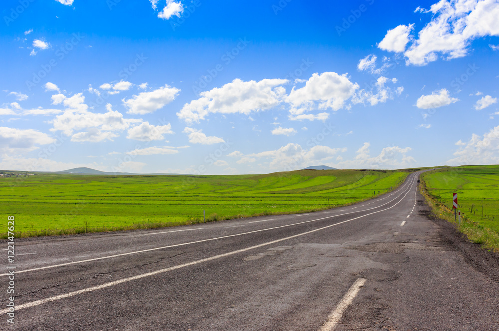 Highway. Open views and sunny weather to travel.