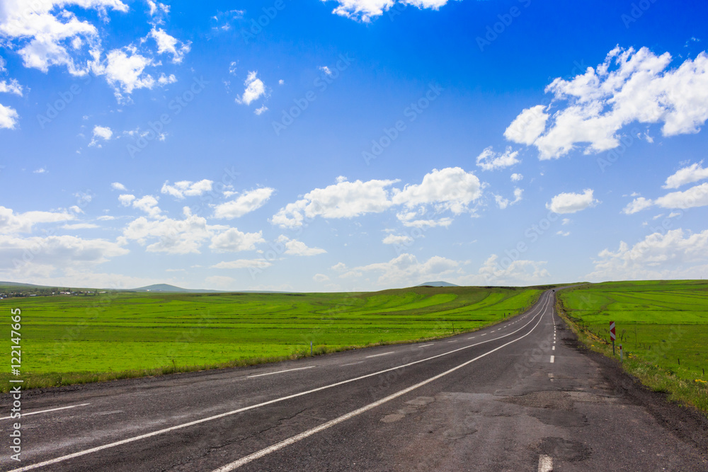 Highway. Open views and sunny weather to travel.