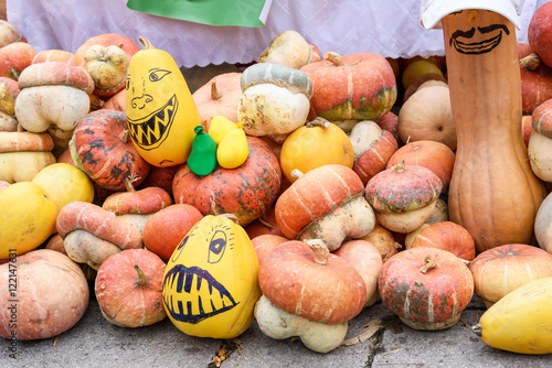 Pile of pumpkins drawn as monsters at harvest festival in Moldova photo