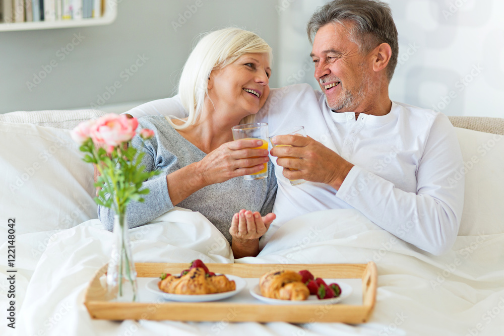 Senior couple enjoying breakfast in bed
Senior couple enjoying breakfast in bed