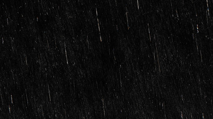 Falling raindrops footage animation in slow motion on black background, black and white luminance matte, rain animation with start and end, perfect for film, digital composition, projection mapping