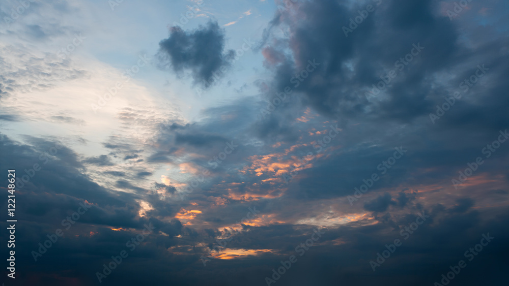 Beautiful autumn evening building clouds with sunset close to night. Clear crisp cloudscape with large, building clouds and light rays, perfect for digital composition background.