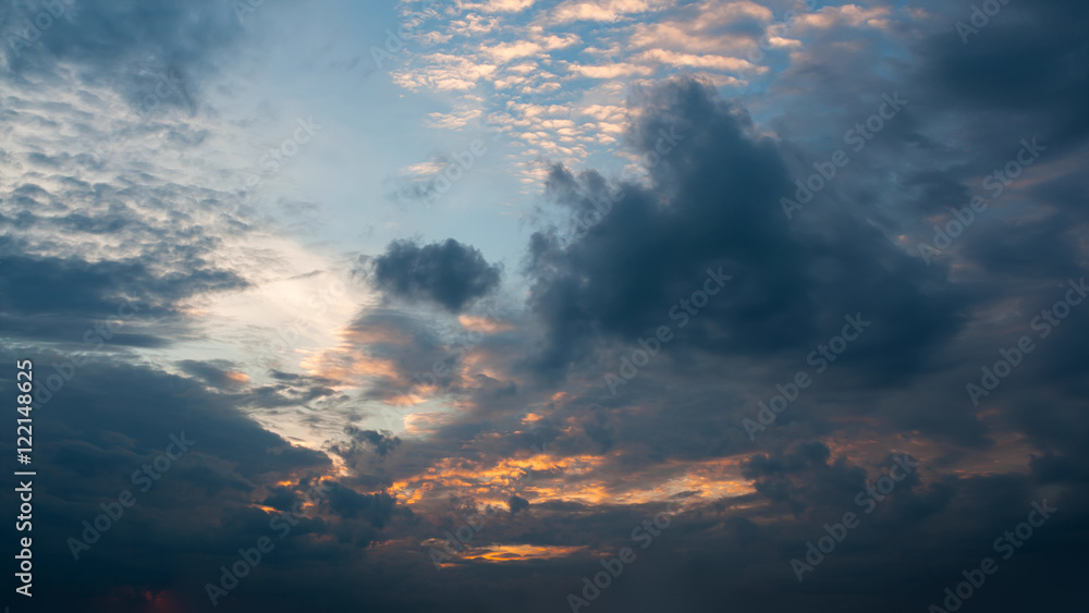 Beautiful autumn evening building clouds with sunset close to night. Clear crisp cloudscape with large, building clouds and light rays, perfect for digital composition background.