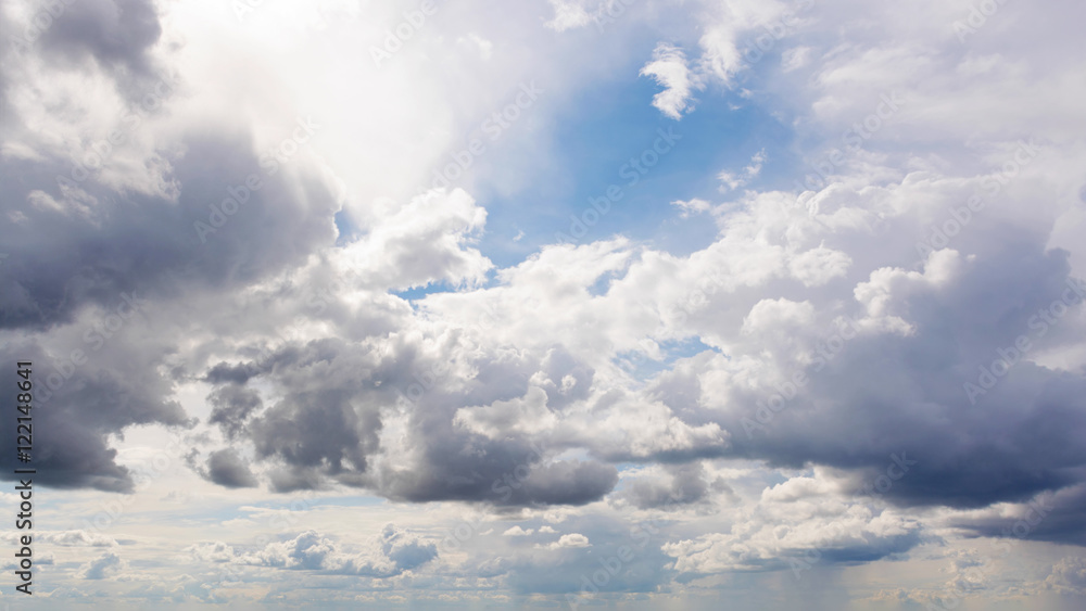 Beautiful summer day sky. Clear crisp cloudscape with large, building clouds, light rays and sun flare, perfect for digital composition background. Beautiful summer day sky. Clear crisp cloudscape with large, building clouds, light rays and sun flare, perfect for digital composition background.