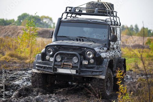 Russian off road car UAZ in mud