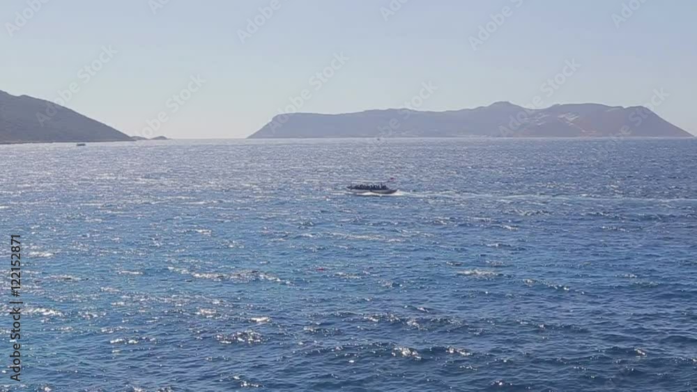 Slow mo Mediterranean sea coast the boat sails on the sea Slow mo Mediterranean sea coast the boat sails on the sea