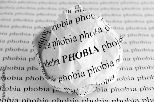 Tableau sur toile Crumpled paper ball with words Phobia