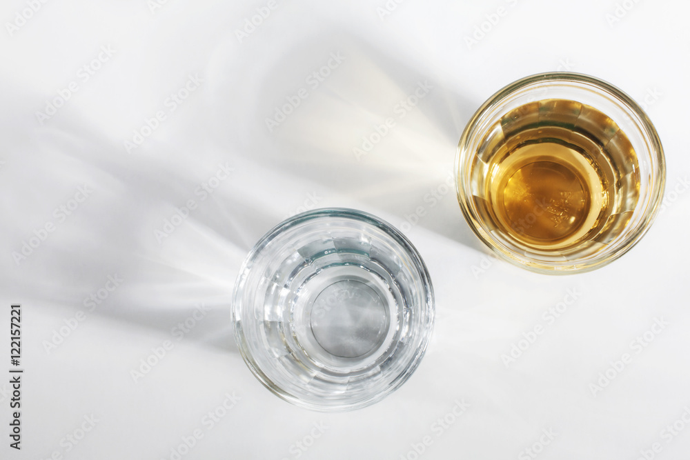 Shot glass of Brazilian cachaca isolated on white background Shot glass of Brazilian cachaca isolated on white background