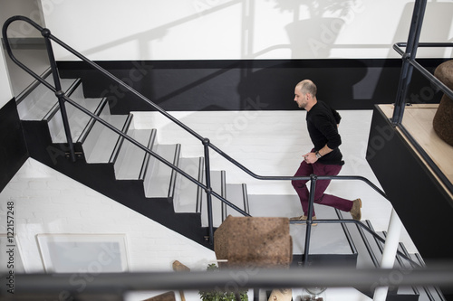Staff running up stairs
