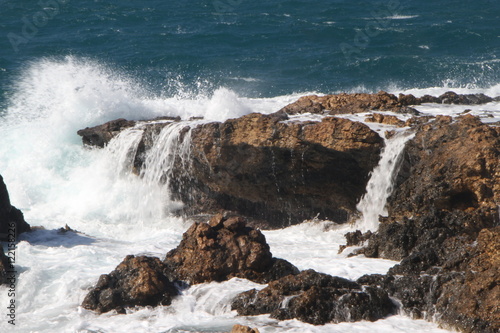 Big waves crashing on rocks in Paros Aegean island