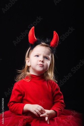 little devil on dark background