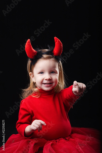 little devil on dark background