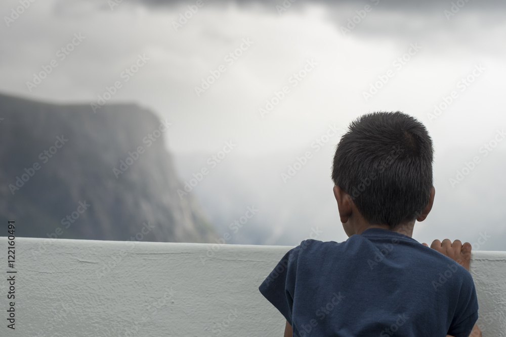 Boy enjoying Western Brook Pond fjord boat tour, Gros Morne Nati Boy enjoying Western Brook Pond fjord boat tour, Gros Morne Nati