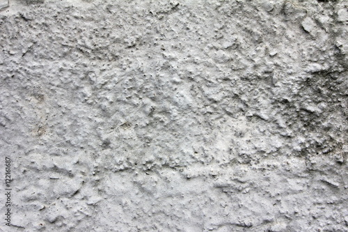 Eroded old grey concrete at a wall for dirty texture  background