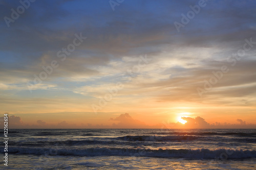 beautiful sunrise dramatic sky with colorful cloud on sea © sutichak