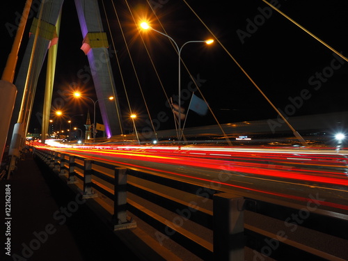 red light on the bridge at the night from thailand photo